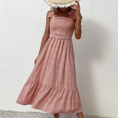 Robe midi dos nu à fleurs par Amélie Morin