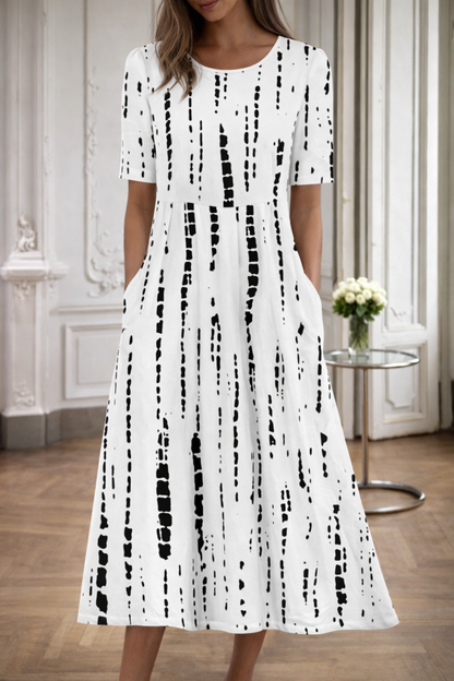 Robe à col rond imprimée de fleurs par Amélie Morin